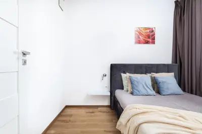 Łóżko lub łóżka w pokoju w obiekcie Business Suite Grzybowska by VAYA STAYS