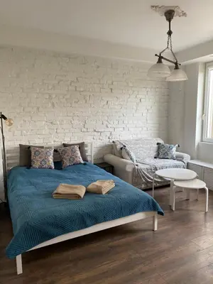 Łóżko lub łóżka w pokoju w obiekcie Chmielna 73C City Centre Apartment