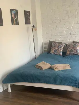 Łóżko lub łóżka w pokoju w obiekcie Chmielna 73C City Centre Apartment