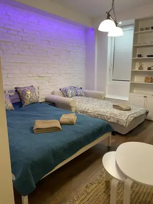 Łóżko lub łóżka w pokoju w obiekcie Chmielna 73C City Centre Apartment
