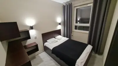 Łóżko lub łóżka w pokoju w obiekcie City Stay Apartament