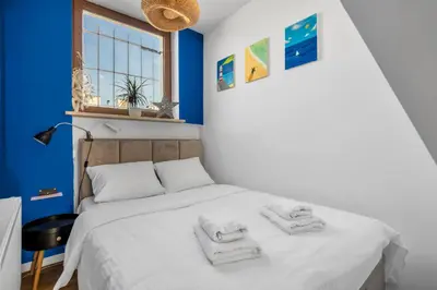 Łóżko lub łóżka w pokoju w obiekcie Plac Politechniki Deluxe Apartment by BookingHost