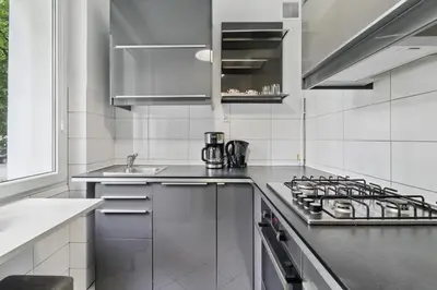 Kuchnia lub aneks kuchenny w obiekcie Paryska Bright & Cozy Stay by Solarento