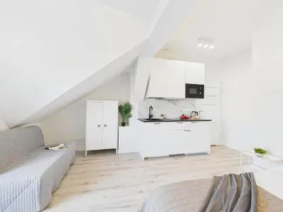 Kuchnia lub aneks kuchenny w obiekcie Bright Apartments with Air Conditioning Near the Copernicus Science Center in Warsaw by Noclegi Renters