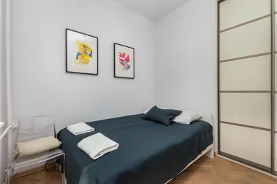 Łóżko lub łóżka w pokoju w obiekcie Aleja Szucha 11 by Homeprime