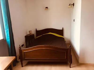 Łóżko lub łóżka w pokoju w obiekcie Miodowy Apartament