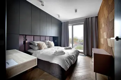 Łóżko lub łóżka w pokoju w obiekcie One Bedroom Apartment Żupnicza Street