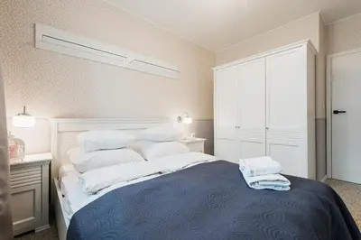 Łóżko lub łóżka w pokoju w obiekcie One Bedroom Apartment Cybernetyki Street