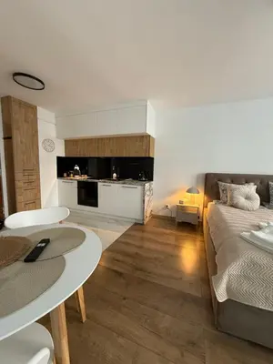Łóżko lub łóżka w pokoju w obiekcie DeLuxury Apartment Chmielna