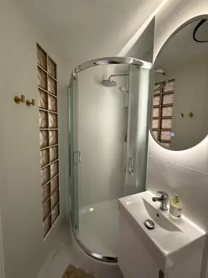 Łazienka w obiekcie DeLuxury Apartment Chmielna