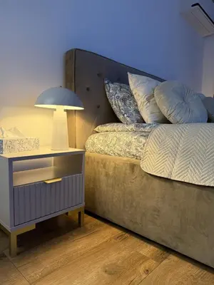 Łóżko lub łóżka w pokoju w obiekcie DeLuxury Apartment Chmielna