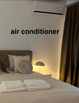 Łóżko lub łóżka w pokoju w obiekcie DeLuxury Apartment Chmielna