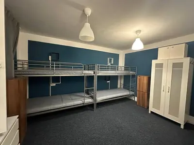 Łóżko lub łóżka w pokoju w obiekcie Team Hostel