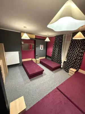 Łóżko lub łóżka w pokoju w obiekcie Team Hostel