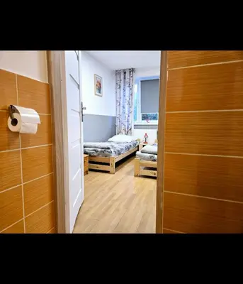 Łóżko lub łóżka w pokoju w obiekcie Rent Warszawa Ursynów