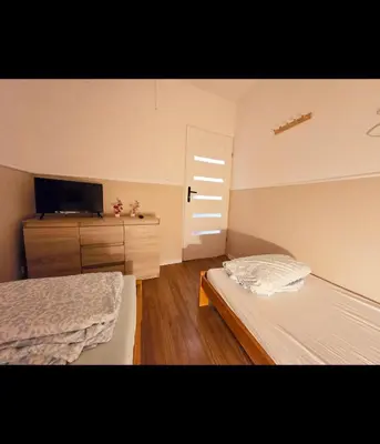 Łóżko lub łóżka w pokoju w obiekcie Rent Warszawa Ursynów
