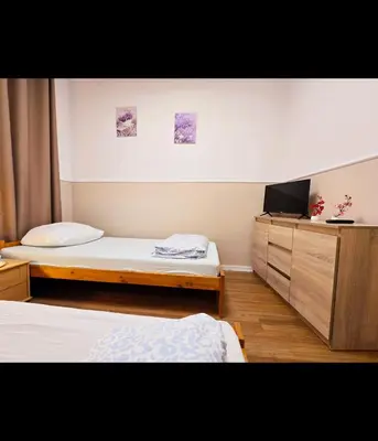 Łóżko lub łóżka w pokoju w obiekcie Rent Warszawa Ursynów