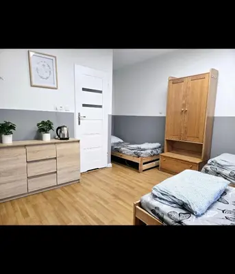 Łóżko lub łóżka w pokoju w obiekcie Rent Warszawa Ursynów