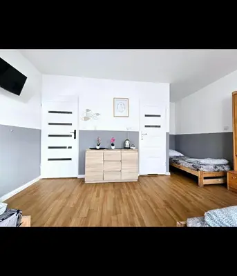 Łóżko lub łóżka w pokoju w obiekcie Rent Warszawa Ursynów