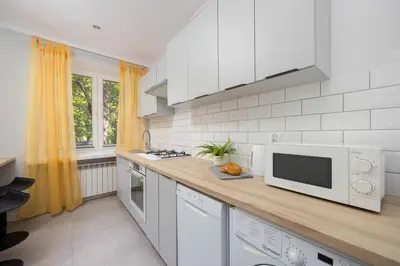 Kuchnia lub aneks kuchenny w obiekcie Modern & Bright Apartment Promenada Park Mokotów Warsaw by Noclegi Renters