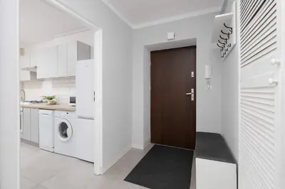 Kuchnia lub aneks kuchenny w obiekcie Modern & Bright Apartment Promenada Park Mokotów Warsaw by Noclegi Renters