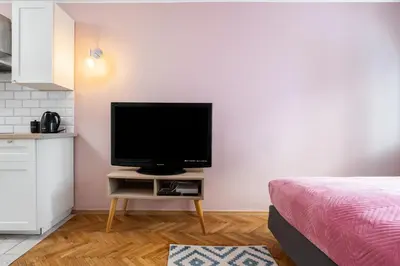 Telewizja i/lub zestaw kina domowego w obiekcie Blue Lagoon Apartment City Center