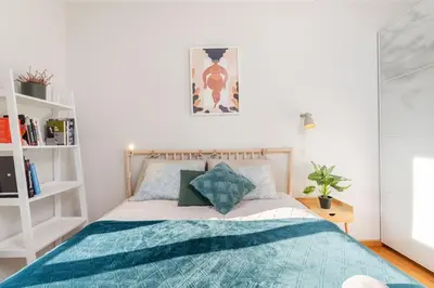 Łóżko lub łóżka w pokoju w obiekcie Caramel Premium Apartment City Center