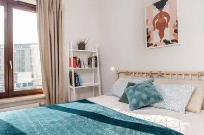 Łóżko lub łóżka w pokoju w obiekcie Caramel Premium Apartment City Center