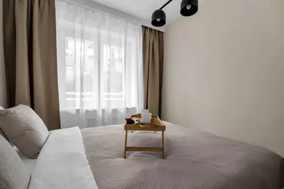 Łóżko lub łóżka w pokoju w obiekcie Ochota Three-Bedroom Apartment - 79m2, Parking, Balcony - by Rentujemy