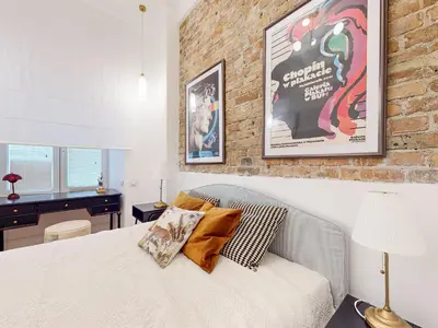 Łóżko lub łóżka w pokoju w obiekcie Apartament na Hożej