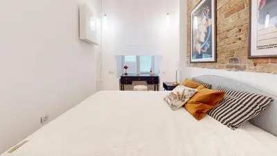 Łóżko lub łóżka w pokoju w obiekcie Apartament na Hożej