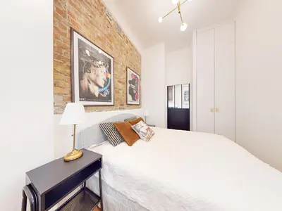 Łóżko lub łóżka w pokoju w obiekcie Apartament na Hożej
