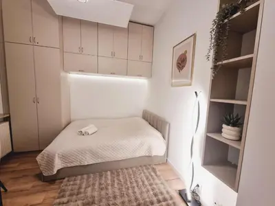 Łóżko lub łóżka w pokoju w obiekcie Central Park Krochmalna Atelier, Rondo ONZ Metro