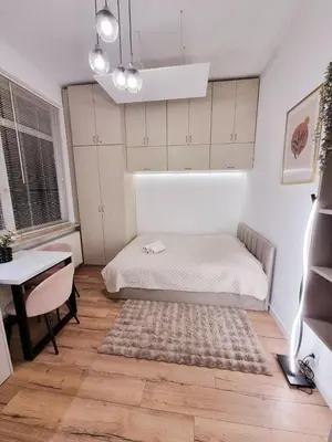 Łóżko lub łóżka w pokoju w obiekcie Central Park Krochmalna Atelier, Rondo ONZ Metro