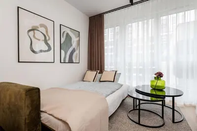 Łóżko lub łóżka w pokoju w obiekcie Earthy Elegance Suite Mokotow