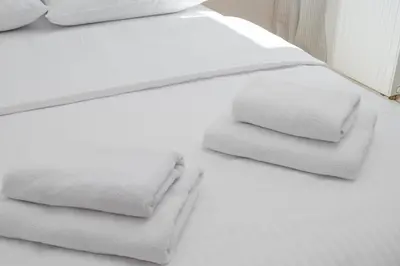 Łóżko lub łóżka w pokoju w obiekcie Praga Łochowska Deluxe Apartment by BookingHost