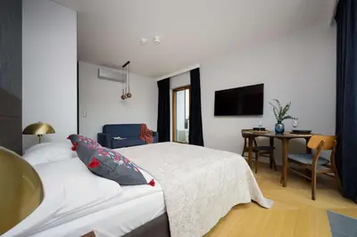 Łóżko lub łóżka w pokoju w obiekcie Modern Studio in Wola with Air Conditioning by Noclegi Renters