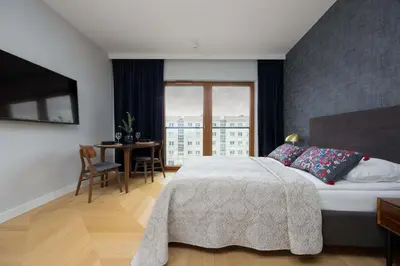 Łóżko lub łóżka w pokoju w obiekcie Modern Studio in Wola with Air Conditioning by Noclegi Renters