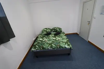 Łóżko lub łóżka w pokoju w obiekcie Fantastic-Inn Warszawa - FMG