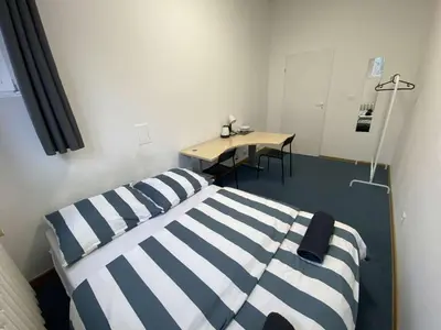 Łóżko lub łóżka w pokoju w obiekcie Fantastic-Inn Warszawa - FMG
