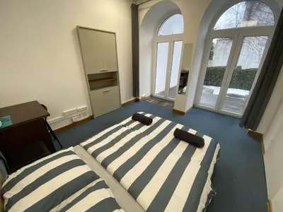 Łóżko lub łóżka w pokoju w obiekcie Fantastic-Inn Warszawa - FMG