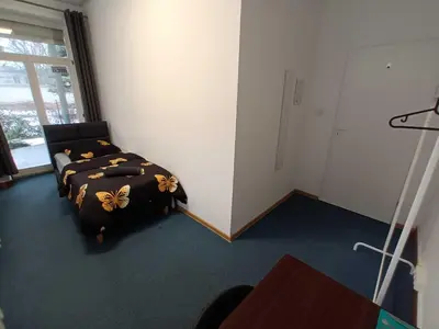 Łóżko lub łóżka w pokoju w obiekcie Fantastic-Inn Warszawa - FMG