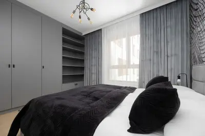 Łóżko lub łóżka w pokoju w obiekcie Elegant Apartment Ludwiki Warszawa with Parking & Air Conditioning by Noclegi Renters