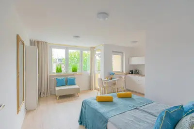 Łóżko lub łóżka w pokoju w obiekcie Green Avenue Apartments A
