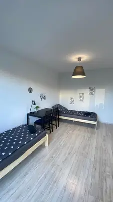 Łóżko lub łóżka w pokoju w obiekcie Rooms in Warsaw - G9