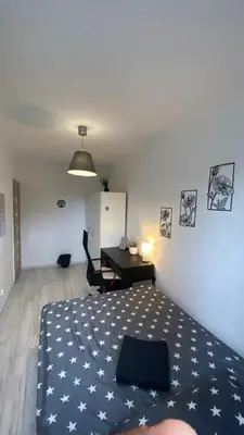 Łóżko lub łóżka w pokoju w obiekcie Rooms in Warsaw - G9