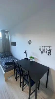 Łóżko lub łóżka w pokoju w obiekcie Rooms in Warsaw - G9