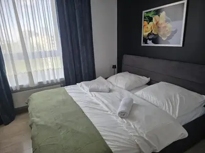 Łóżko lub łóżka w pokoju w obiekcie WB2 Wyrafinowany luksusowy apartament w centrum