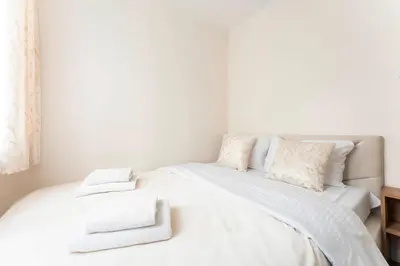 Łóżko lub łóżka w pokoju w obiekcie Jerozolimskie Premium Apartment