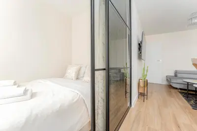 Łóżko lub łóżka w pokoju w obiekcie Jerozolimskie Premium Apartment